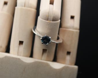 Knife Edge Solitaire with blue Topaz