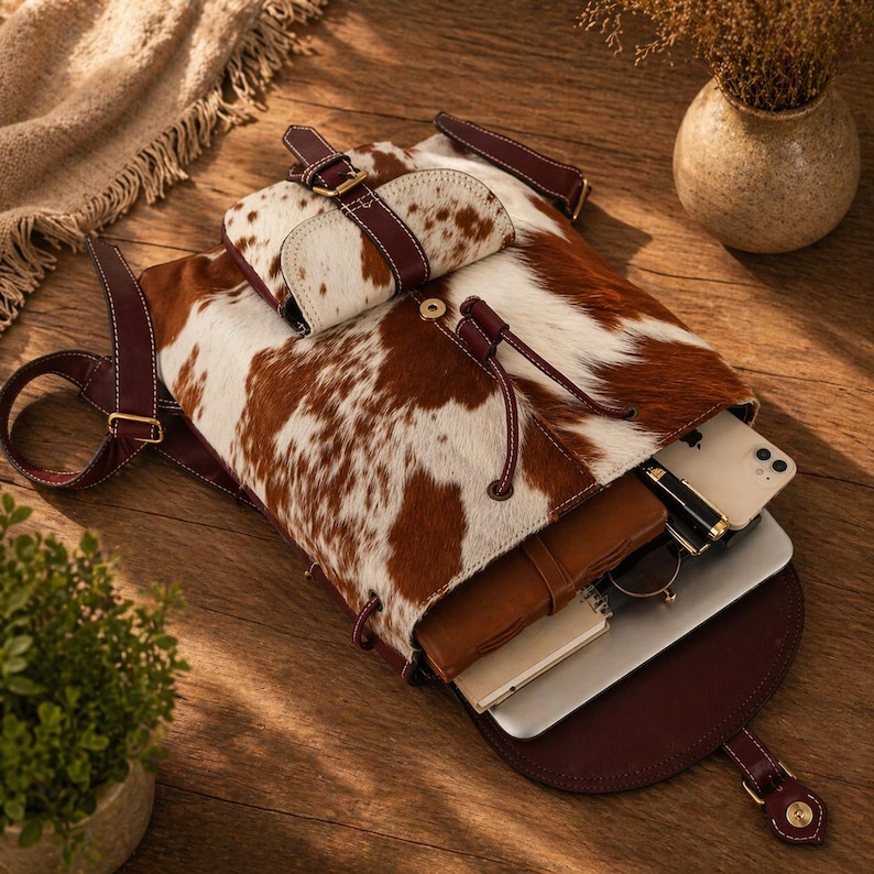 cowhide backpack
leather backpack
western backpack
cow print bag
hair on hide bag
boho backpack
western purse
leather rucksack
cowhide purse
rustic leather bag
travel backpack
backpack for her
handmade backpack