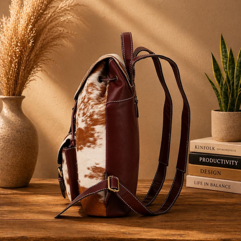 cowhide backpack
leather backpack
western backpack
cow print bag
hair on hide bag
boho backpack
western purse
leather rucksack
cowhide purse
rustic leather bag
travel backpack
backpack for her
handmade backpack