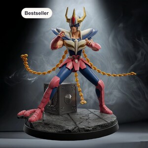 May include: A collectible figurine of a warrior wearing a blue and pink suit of armor with a gold-horned helmet. The figure stands in a combat pose with a long gold chain extending from the waist, positioned atop a dark, cracked stone base.