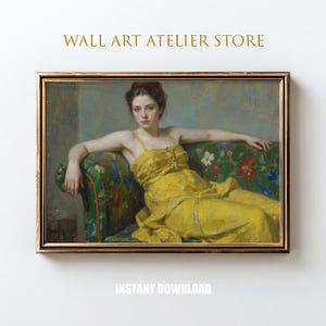 May include: A framed wall art print featuring a classical painting of a woman in a yellow dress reclining on a floral patterned sofa. The artwork has a gold frame and the text "WALL ART ATELIER STORE" and "INSTANT DOWNLOAD".