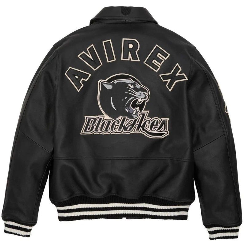 May include: Black leather jacket with the word "AVIREX" arched across the shoulders. A panther graphic and the words "Black Aces" are below the brand name. The jacket has a ribbed collar, cuffs, and hem with white stripes.