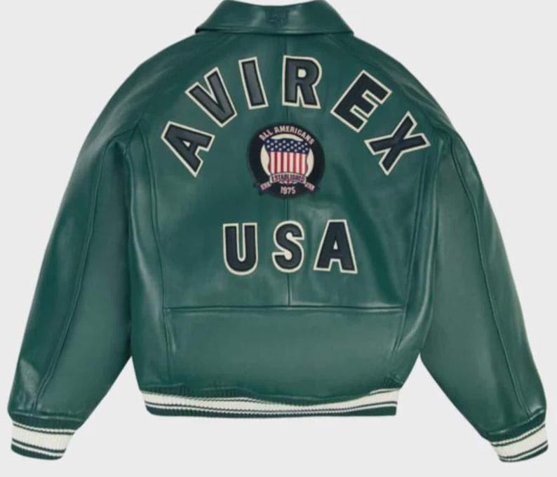 May include: Green leather jacket with white and black striped cuffs and hem. The back of the jacket features the word "AVIREX" in white block letters, above a patch with a red, white, and blue design and the word "USA" in white block letters.