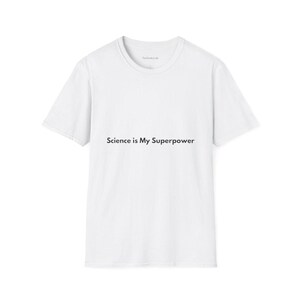 May include: White t-shirt with the text "Science is My Superpower" in black. The shirt has a crew neck and short sleeves. The Geeky Lab logo is visible on the upper back of the shirt.