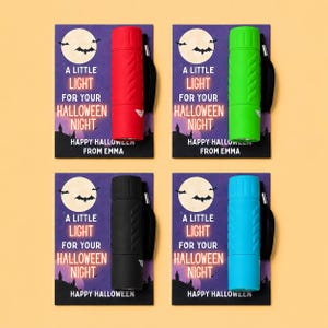 May include: Four flashlights in red, green, black, and blue, each with a black wrist strap, attached to individual cards featuring a full moon, bats, and the text: A LITTLE LIGHT FOR YOUR HALLOWEEN NIGHT. HAPPY HALLOWEEN FROM EMMA.