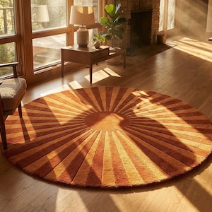 A beautifully handcrafted round sunburst rug placed in a warm, sunlit modern living room. The rug features a striking radial pattern in