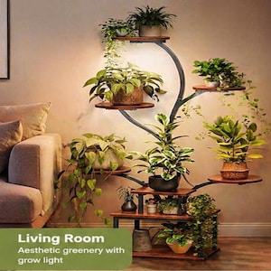 May include: A multi-tiered plant stand with a black metal frame and wooden shelves, filled with various potted plants. The stand has a unique, tree-like design and is illuminated by a grow light, creating a vibrant display of greenery in a living room setting.