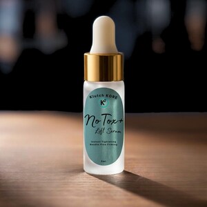 May include: A small, frosted glass bottle with a white dropper and gold-colored cap. The label reads "Klutch Kore K2 No Tox+ Lift Serum" with text below indicating instant tightening and needle-free firming. The bottle is 5ml.