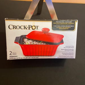 May include: A rustic wooden sign with the text "Welcome to our home" in white lettering. The sign features a distressed finish and a simple, inviting design, perfect for entryway decor.