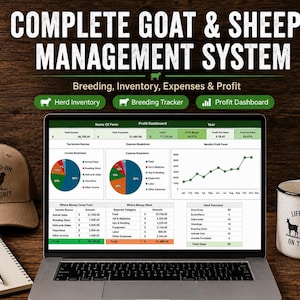 May include: A laptop displaying a Complete Goat & Sheep Management System dashboard with pie charts and tables, accompanied by a tan baseball cap with a goat and sheep graphic, a white mug with the text Life is Better on the Farm, and a notebook.