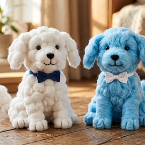 May include: Two plush dog toys. One is white with a navy blue bow tie, the other is light blue with a white bow tie with small polka dots. Both have black eyes and noses and are sitting on a wooden surface.