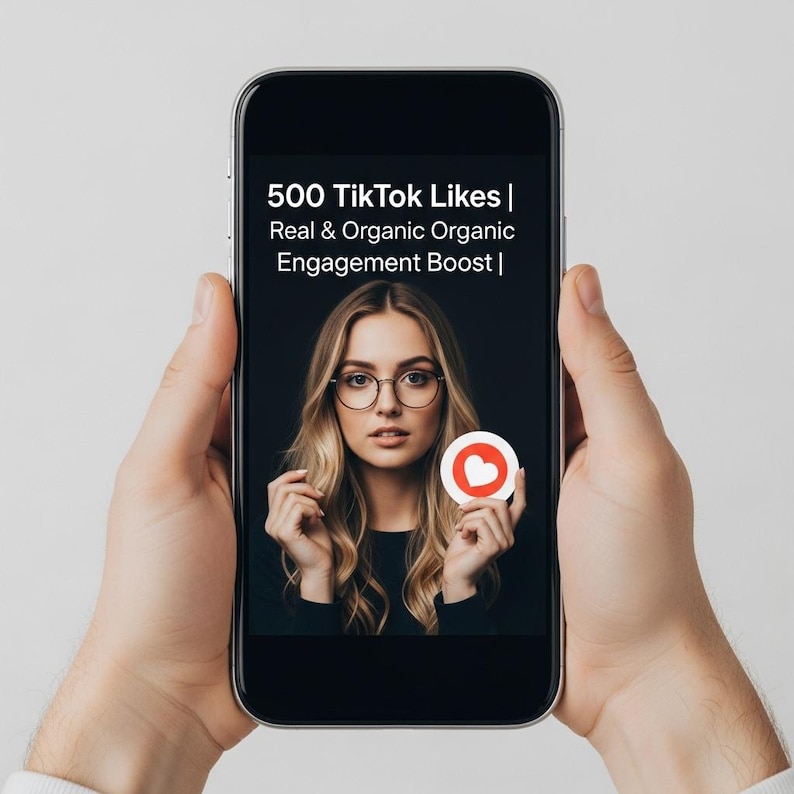 May include: A smartphone displays an advertisement for 500 TikTok likes. The ad features a woman with glasses holding a heart-shaped icon. The text reads "500 TikTok Likes | Real & Organic Organic Engagement Boost |". The phone is held by a person.