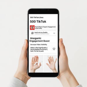 May include: A smartphone displaying a TikTok promotion service. The screen shows text including "500 TikTok Likes," "Aneganic Engagement Boost," and "Increase Video Visibility." The phone is held in two hands against a white background.