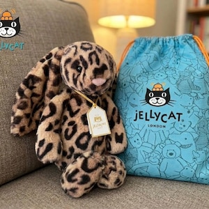 Peluche de conejo Jellycat Cobblehop con estampado de leopardo y bolsa guardapolvo / Juguete de peluche de conejo adorable / Muñeco de dibujos animados suave, regalos de cumpleaños para niños