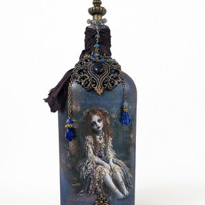 Haunted Victorian Doll Bottle Gothic Altered Art Decor – Mixed Media Glass with Crystal Dangles, Sari Ribbon & Metal Embellishments – OOAK