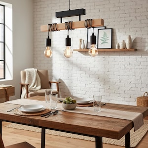 May include: A dining room with a wooden table and a three-light pendant light. The pendant light has a black metal base and a light-coloured wooden beam. The Edison bulbs hang above the table, which is set for a meal.