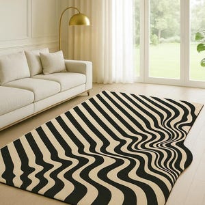 May include: A black and cream striped rug with a distorted, wavy pattern. The rug is laid on a wooden floor in a living room. The room includes a cream sofa, a gold floor lamp, and large windows with curtains.