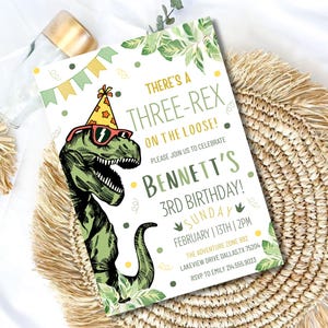 May include: A birthday invitation with a green dinosaur wearing sunglasses and a party hat. The invitation reads "There's a Three-Rex on the Loose!" and includes details for Bennett's 3rd birthday.