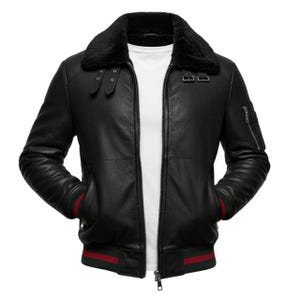 May include: Black leather bomber jacket with a black faux fur collar. The jacket features a zipper closure, two front pockets, and a red and green striped trim on the cuffs and hem. The jacket is shown against a white background.