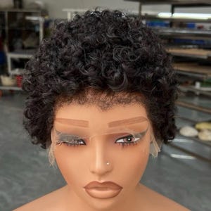 May include: A set of three ceramic mugs with a speckled, matte finish. The mugs are in shades of cream, light gray, and dark gray. Each mug has a simple, minimalist design and a rounded handle.