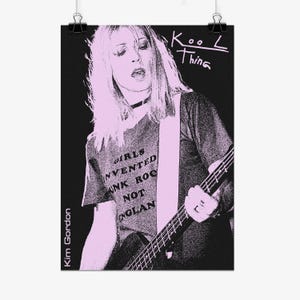 May include: A black and light pink poster featuring a graphic illustration of a person playing a bass guitar. The person wears a t-shirt with the text GIRLS INVENTED PUNK ROCK NOT ENGLAND. The text Kool Thing and Kim Gordon are visible.