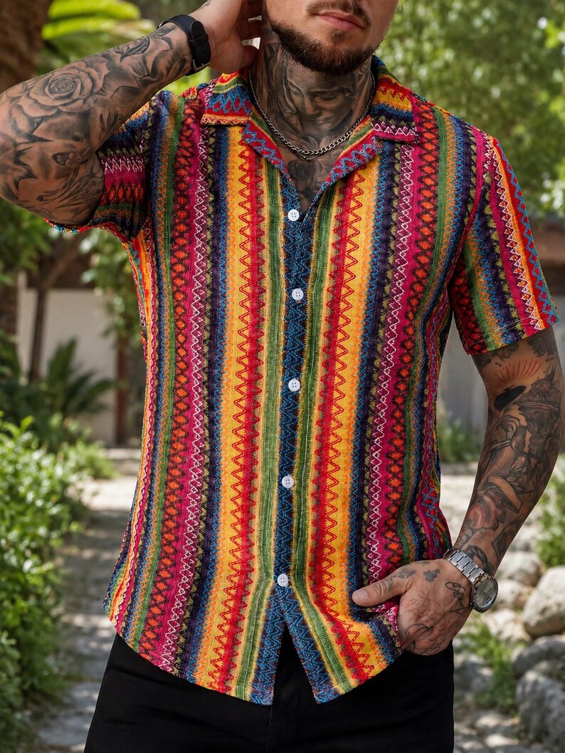 May include: A short-sleeved button-down shirt featuring a vibrant, vertical striped pattern in shades of red, yellow, green, and blue. The shirt has a classic collar, white buttons down the front, and a textured fabric with intricate geometric details.