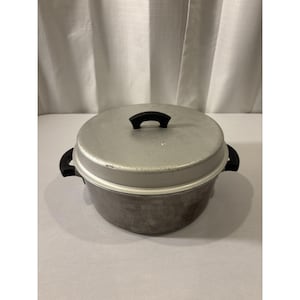 May include: A set of three ceramic mugs with a speckled, matte finish. The mugs are in shades of cream, light gray, and dark gray. Each mug has a simple, minimalist design and a rounded handle. The mugs are likely for coffee or tea.