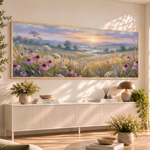 May include: A panoramic landscape painting in a wooden frame depicting a meadow with purple coneflowers, white wildflowers, and golden wheat under a soft sunrise sky with rolling hills and a winding path in the distance.