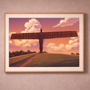 May include: Framed art print of the Angel of the North sculpture. The artwork shows the steel sculpture with outstretched wings against a sunset sky with clouds. The print is in a wooden frame and hangs on a pink wall.