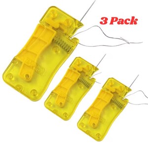 May include: Three yellow needle threaders with a clear plastic casing and a metal wire needle. The threaders have a lever and spring mechanism. The text "3 Pack" is visible in the image.