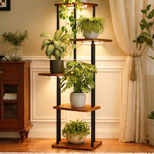 May include: A multi-tiered plant stand with black metal supports and wooden shelves. The stand holds various potted plants, including leafy green plants and trailing vines. The stand is illuminated by built-in lights, creating a warm ambiance.