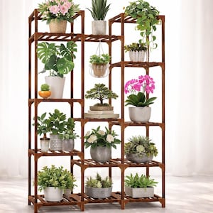 May include: A set of three ceramic mugs with a speckled, matte finish. The mugs are in shades of cream, light gray, and dark gray. Each mug has a simple, minimalist design and a rounded handle. The mugs are likely for coffee or tea.