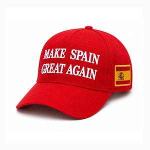 May include: A bright red baseball cap featuring the white embroidered text MAKE SPAIN GREAT AGAIN on the front panel. The side of the cap displays a rectangular patch with the national flag of Spain, featuring horizontal red and yellow stripes.