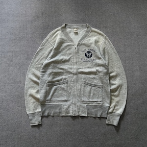 May include: A light gray zip-up sweatshirt with two front pockets and ribbed cuffs and hem. The front features a navy blue emblem with the text "U.S. ARMY AIR FORCES" and the location "RANDOLPH FIELD, TX".