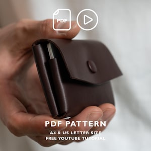 May include: A dark brown leather card holder with a flap closure and a single snap button. The item is presented as a PDF pattern for A4 and US letter sizes, accompanied by a free YouTube tutorial. The design features a smooth finish.