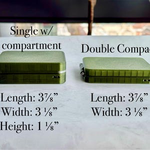 May include: Two olive green rectangular cases. The left case is labelled Single w/ compartment with dimensions 3 7/8 inches length, 3 1/8 inches width, and 1 1/8 inches height. The right case is labelled Double Compact with dimensions 3 7/8 inches length and 3 1/8 inches width.