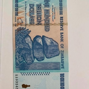 May include: A Zimbabwean one hundred trillion dollar bill. The bill is primarily blue and features the text "ONE HUNDRED TRILLION DOLLARS" and "RESERVE BANK OF ZIMBABWE". The bill also has a picture of rocks.