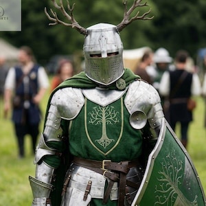 May include: A person in medieval armor with a silver helmet adorned with antlers. The armor includes a green tunic with a tree design, a matching shield, and a green cape. The image has the word "Knights" in the top left corner.