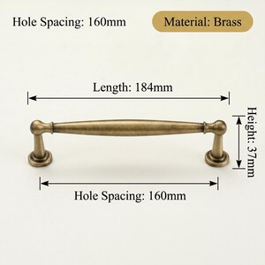 May include: A brass cabinet pull, 18.4cm long and 3.7cm high, with a hole spacing of 16cm. The pull has a classic design. The material is brass.