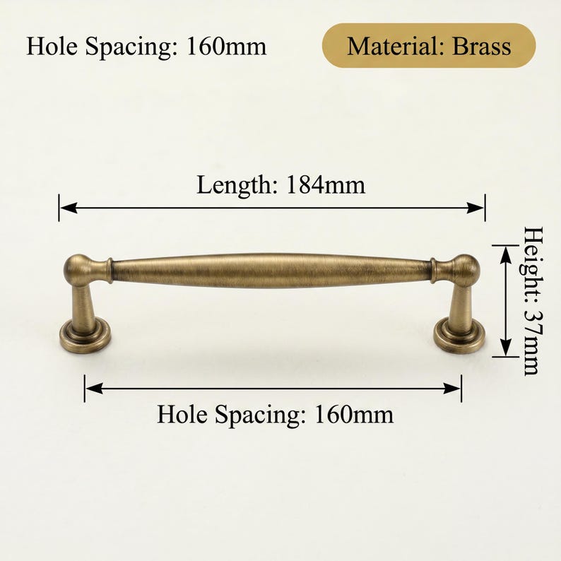 May include: A brass cabinet pull, 18.4cm long and 3.7cm high, with a hole spacing of 16cm. The pull has a classic design. The material is brass.
