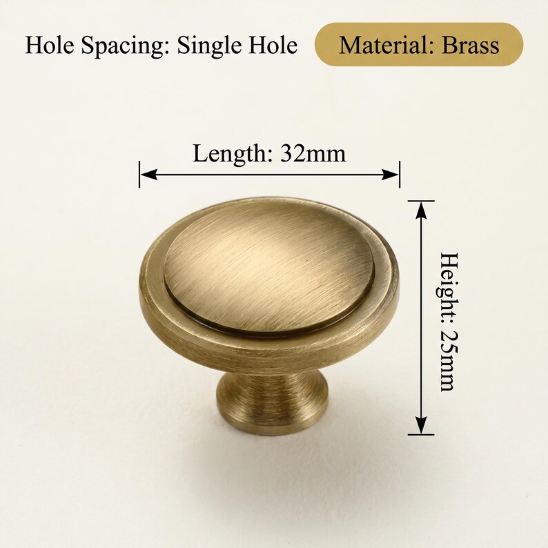 May include: A brass cabinet knob with a single hole spacing. The knob is a warm gold colour, with a round top and a stem. The length is 32mm and the height is 25mm.