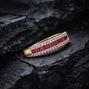 May include: A trio of cream-glazed ceramic mugs, each adorned with a hand-painted floral pattern in blue, green, and yellow. The mugs have a speckled finish and a minimalist design. Ideal for tea or coffee.