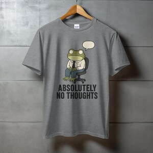 Grey t-shirt with a cartoon frog wearing a suit and tie, saying "ABSOLUTELY NO THOUGHTS".