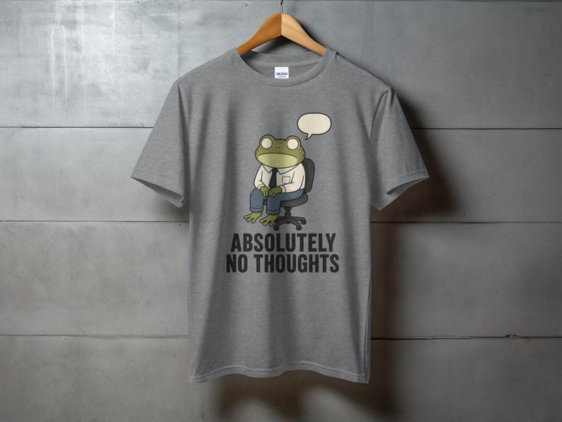 Grey t-shirt with a cartoon frog wearing a suit and tie, saying "ABSOLUTELY NO THOUGHTS".