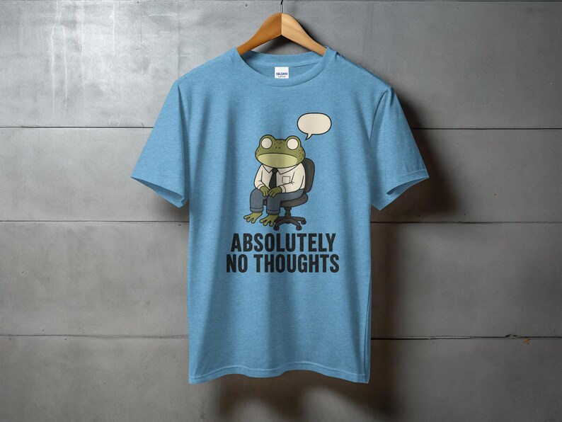 Blue t-shirt with cartoon frog saying "ABSOLUTELY NO THOUGHTS".