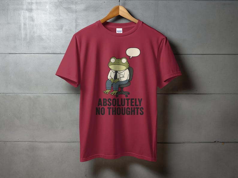 Maroon t-shirt with cartoon frog wearing suit, "ABSOLUTELY NO THOUGHTS" text.