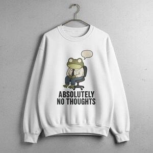 White sweatshirt with frog in chair thinking "Absolutely No Thoughts".