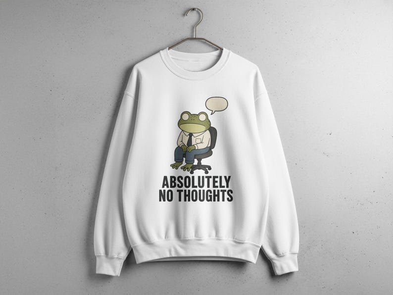 White sweatshirt with frog in chair thinking "Absolutely No Thoughts".
