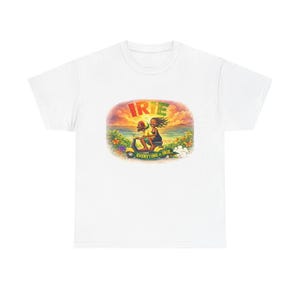 May include: White t-shirt featuring a colorful graphic of two people riding a scooter. The graphic includes the word "IRIE" in green, yellow, and red, and the phrase "EVERYTHING IS IRIE." The design has a tropical theme with flowers and a sunset background.