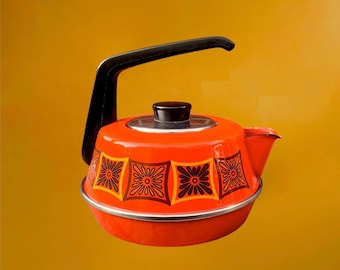 May include: A bright orange tea kettle featuring a black handle and a black lid knob. The body of the kettle is decorated with a repeating pattern of dark brown and orange square floral motifs. It has a silver-toned metal rim at the base.